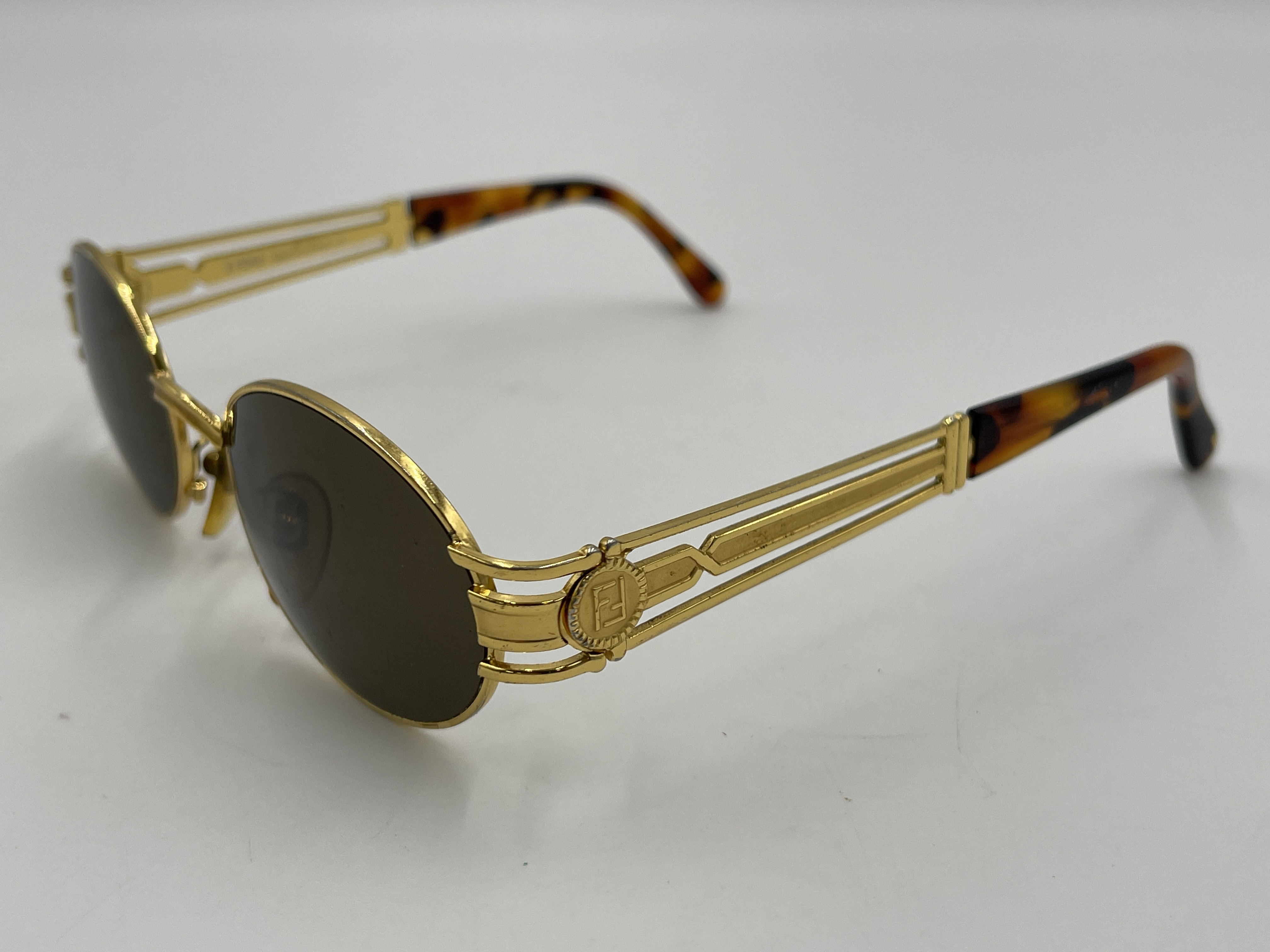 A Pair of Vintage Fendi Gold-Tone Oval Sunglasses, Model SL 7031