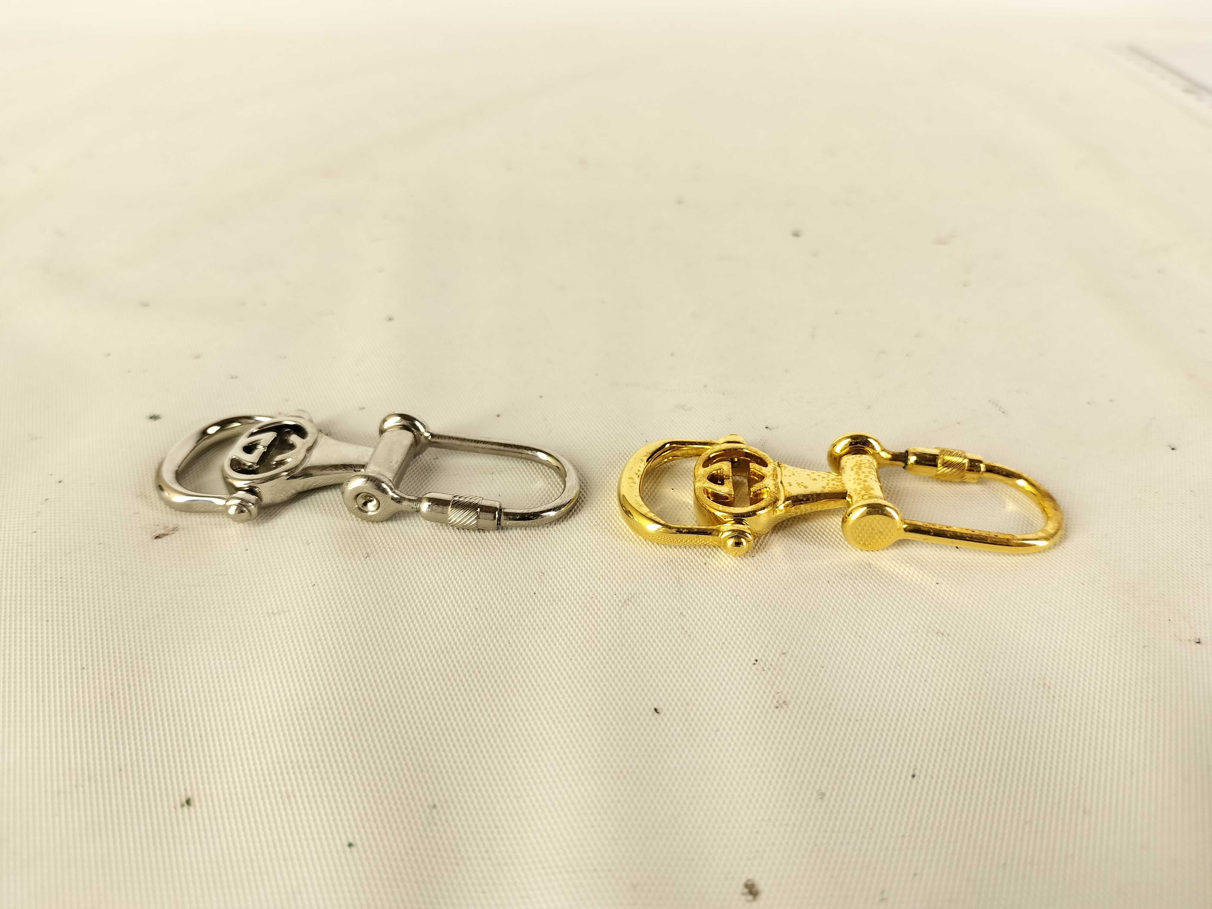 Two Vintage Gucci Interlocking G Metal Keychains with Box