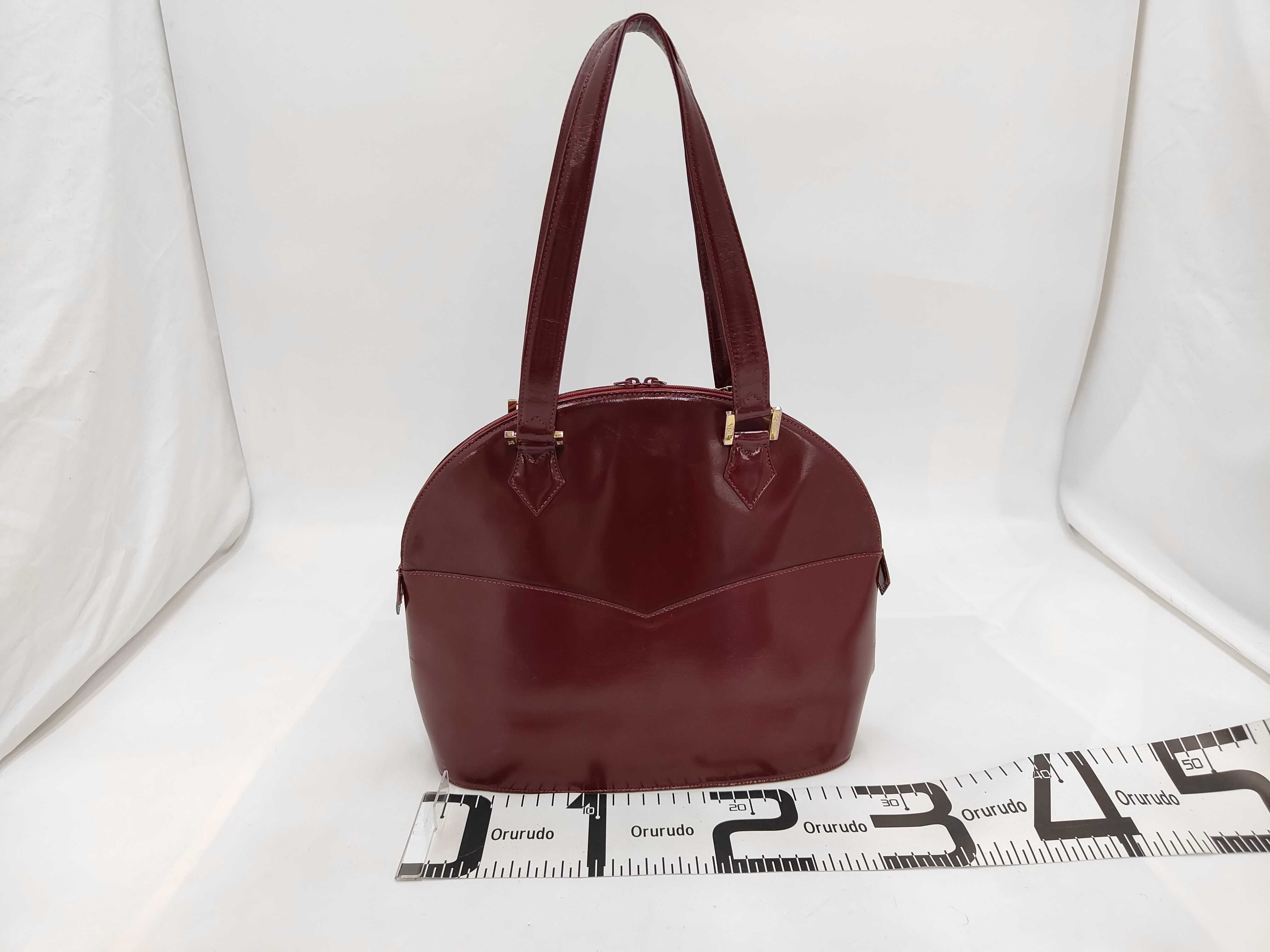 A Vintage Yves Saint Laurent Burgundy Glossy Grain Leather Dome Shoulder Bag