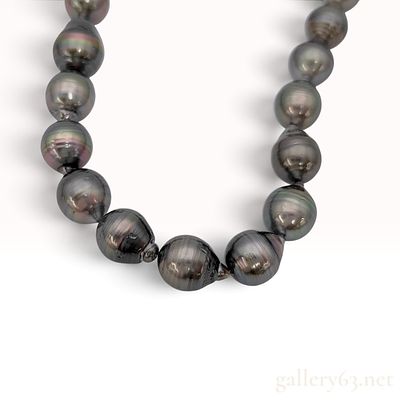 Graduated Circled Baroque Tahitian Pearl Necklace with Silver and Colorless Stone Clasp. This is 