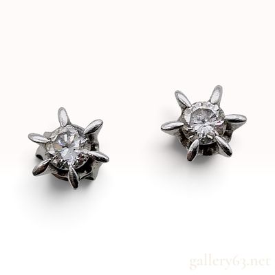 Platinum and Natural Diamond Starburst Stud Earrings. This is a matched pair of platinum stud 