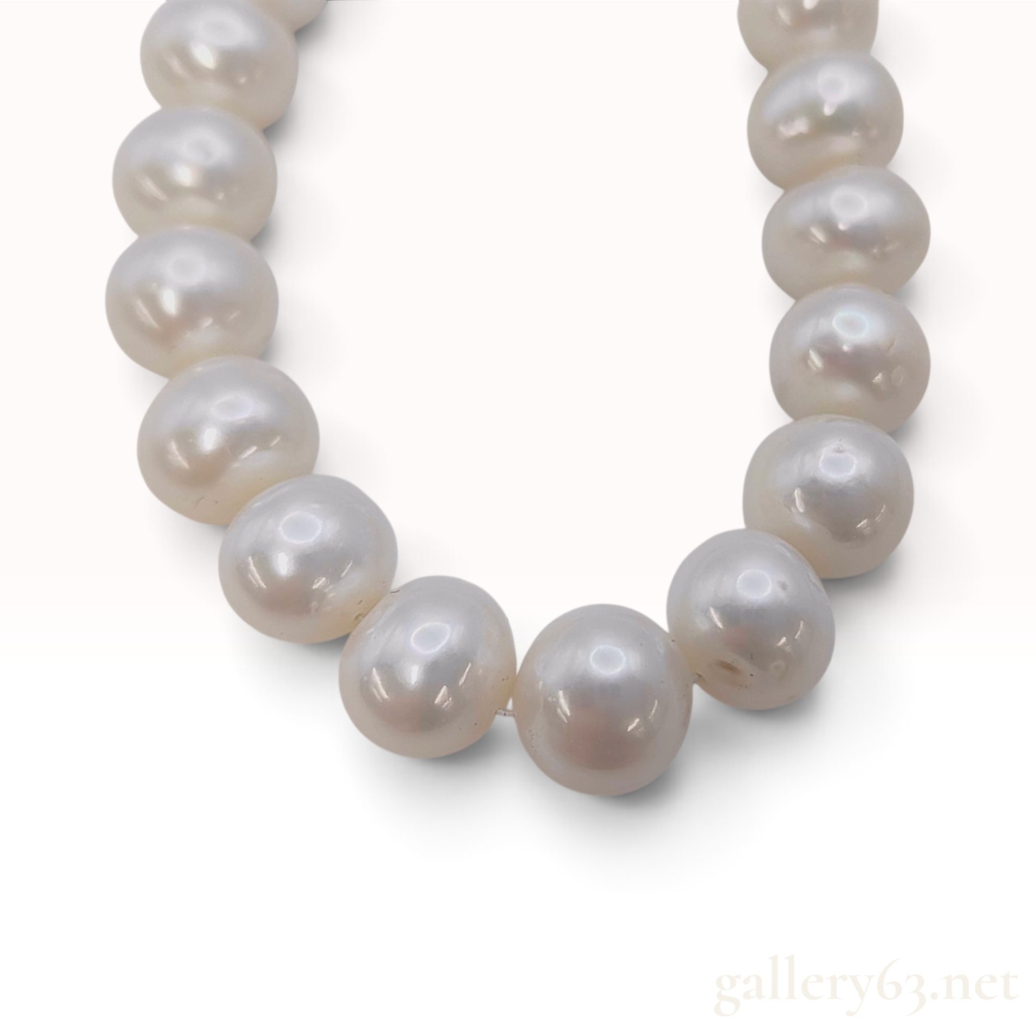 A Single Strand Cultured Pearl Necklace with Yellow Gold Toned Clasp