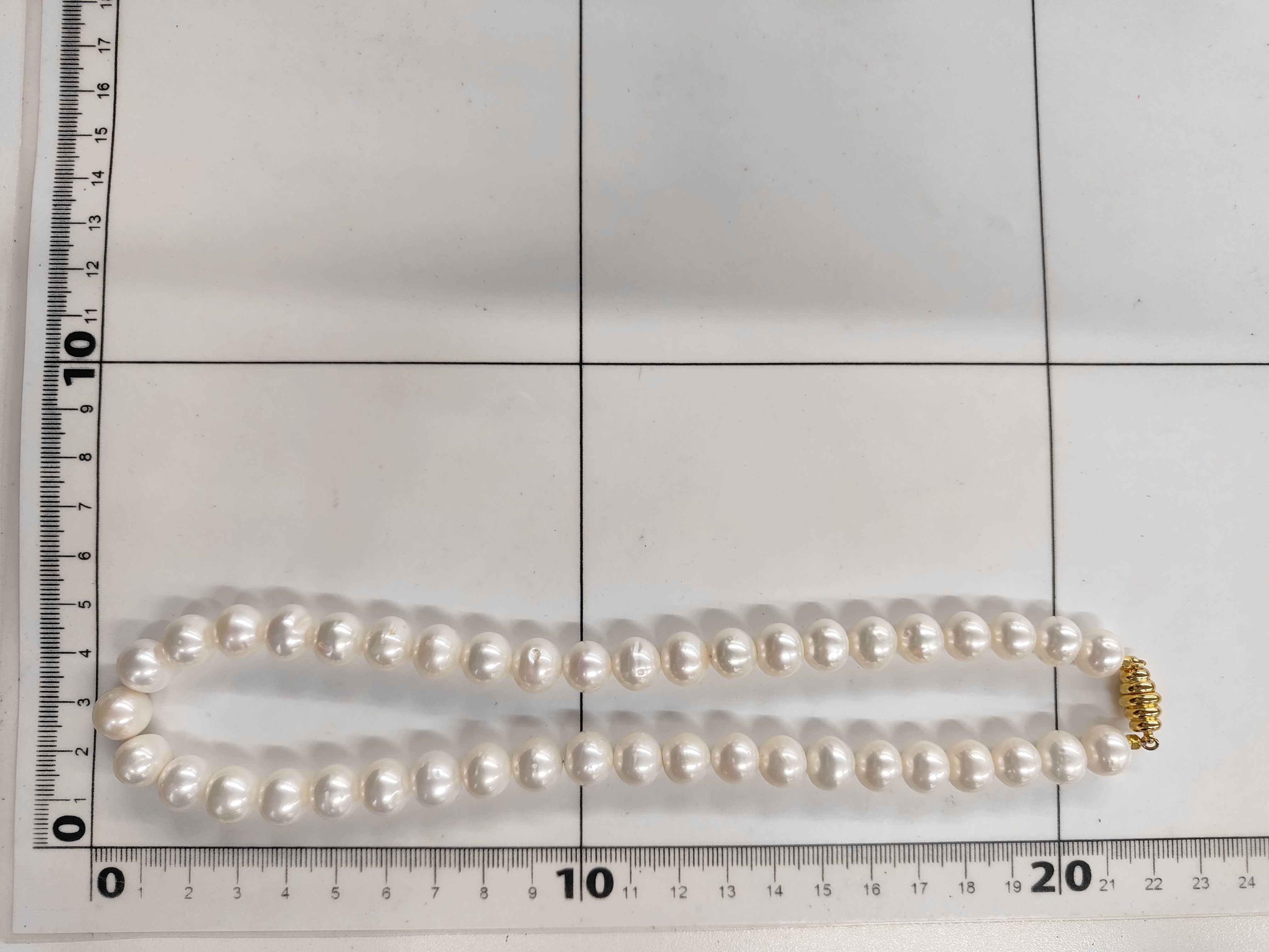 A Single Strand Cultured Pearl Necklace with Yellow Gold Toned Clasp