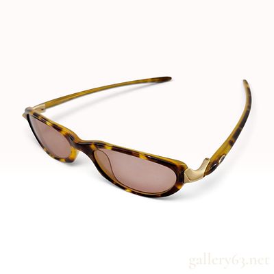Oakley Tangent Tortoise Acetate Sunglasses. This pair of Oakley Tangent sunglasses is crafted 