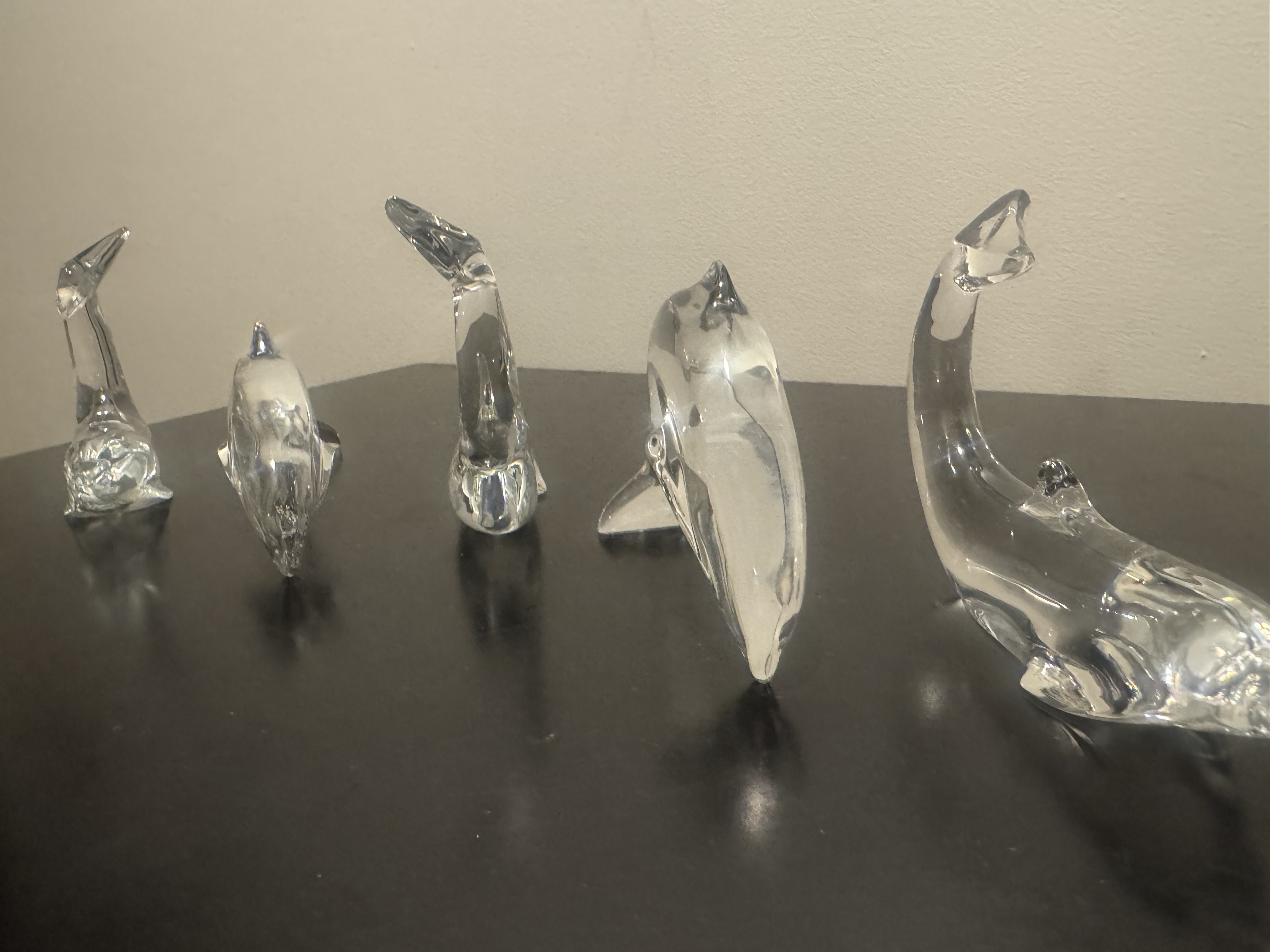 BACCARAT (French) -- Group of Five Clear Crystal Dolphin Sculptures, Signed