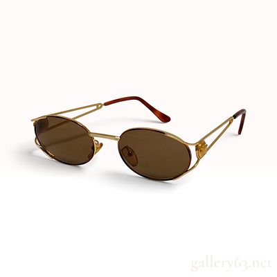 Vintage Versace Gold-Toned Medusa Medallion Oval Sunglasses with Case. These vintage Versace 