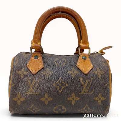 Louis Vuitton Monogram Mini Speedy HL Bag. This Louis Vuitton Mini Speedy HL handbag is 