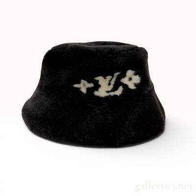 Louis Vuitton Shearling Monogram Bucket Hat. This contemporary Louis Vuitton bucket hat is 