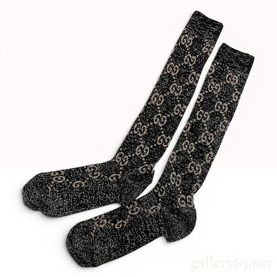 A Pair of Gucci Monogram Metallic Lame Knee-High Socks. A pair of knee-high socks attributed to 