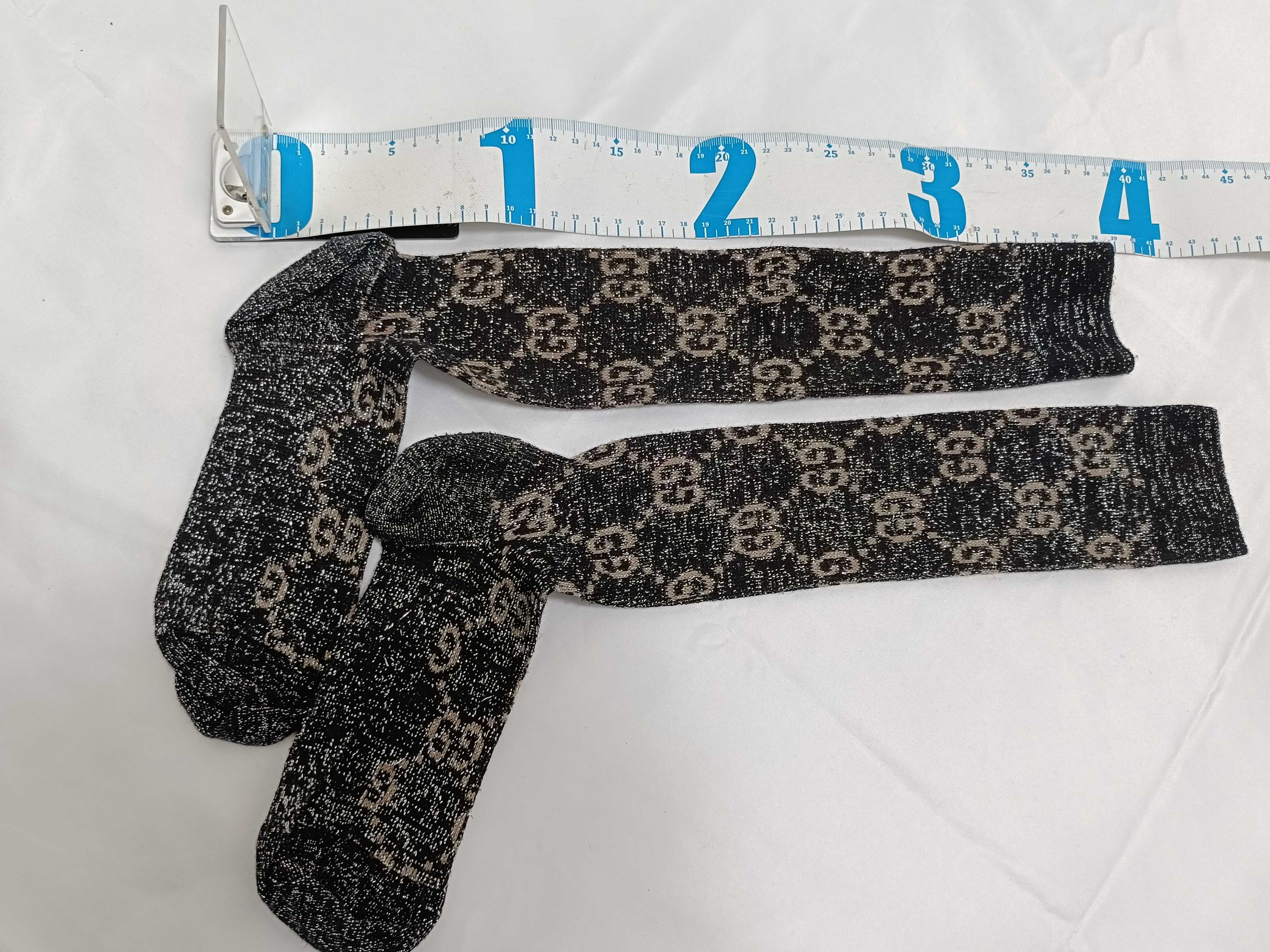 A Pair of Gucci Monogram Metallic Lame Knee-High Socks