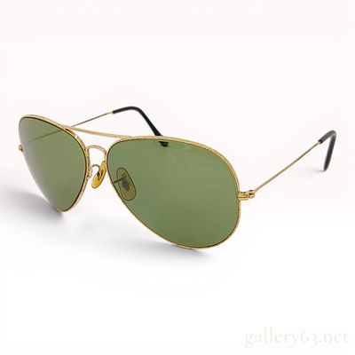 Vintage Bausch & Lomb Ray-Ban Gold-Toned Aviator Sunglasses. A pair of vintage aviator-style 