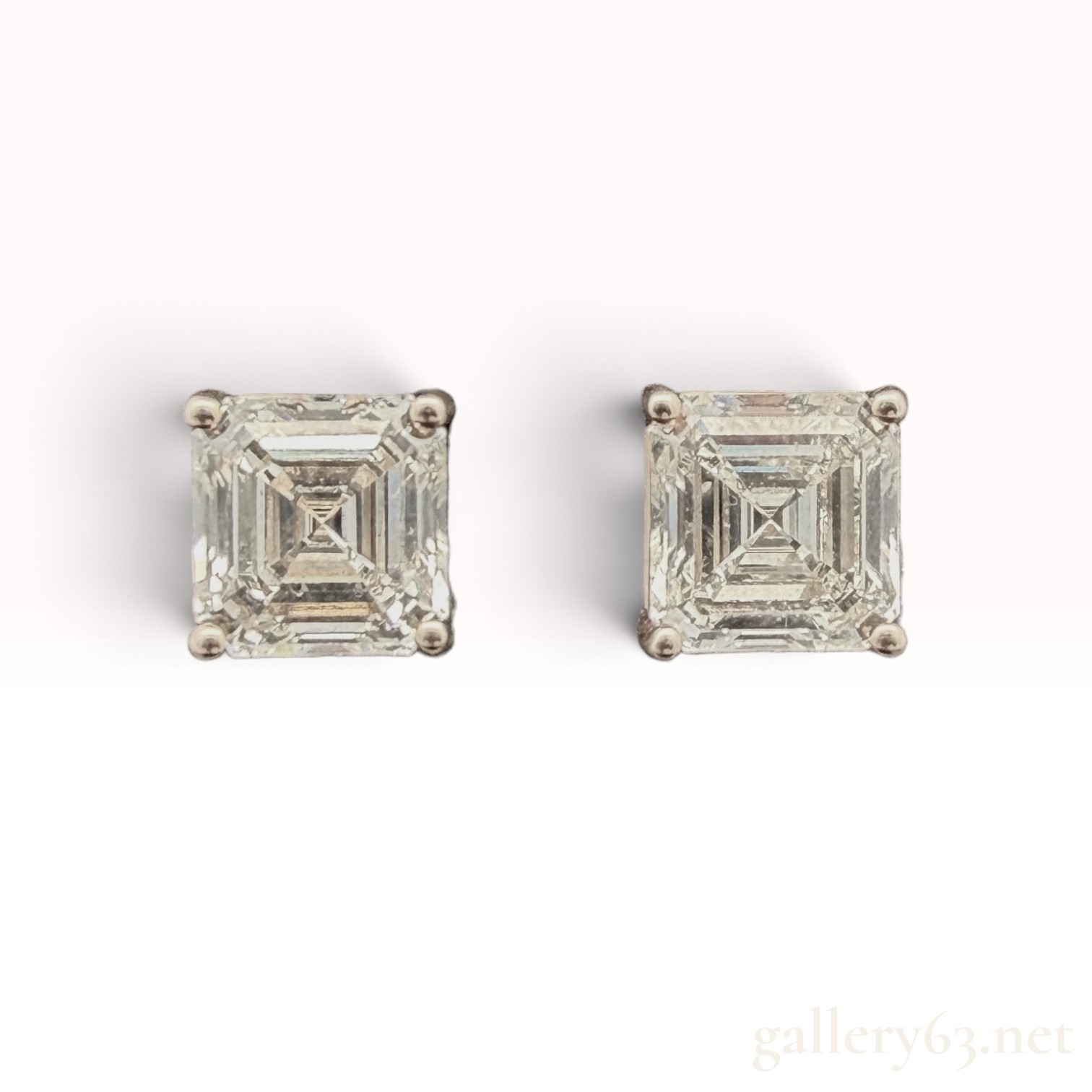 A Pair of 14K Gold Asscher-Cut Diamond Stud Earrings