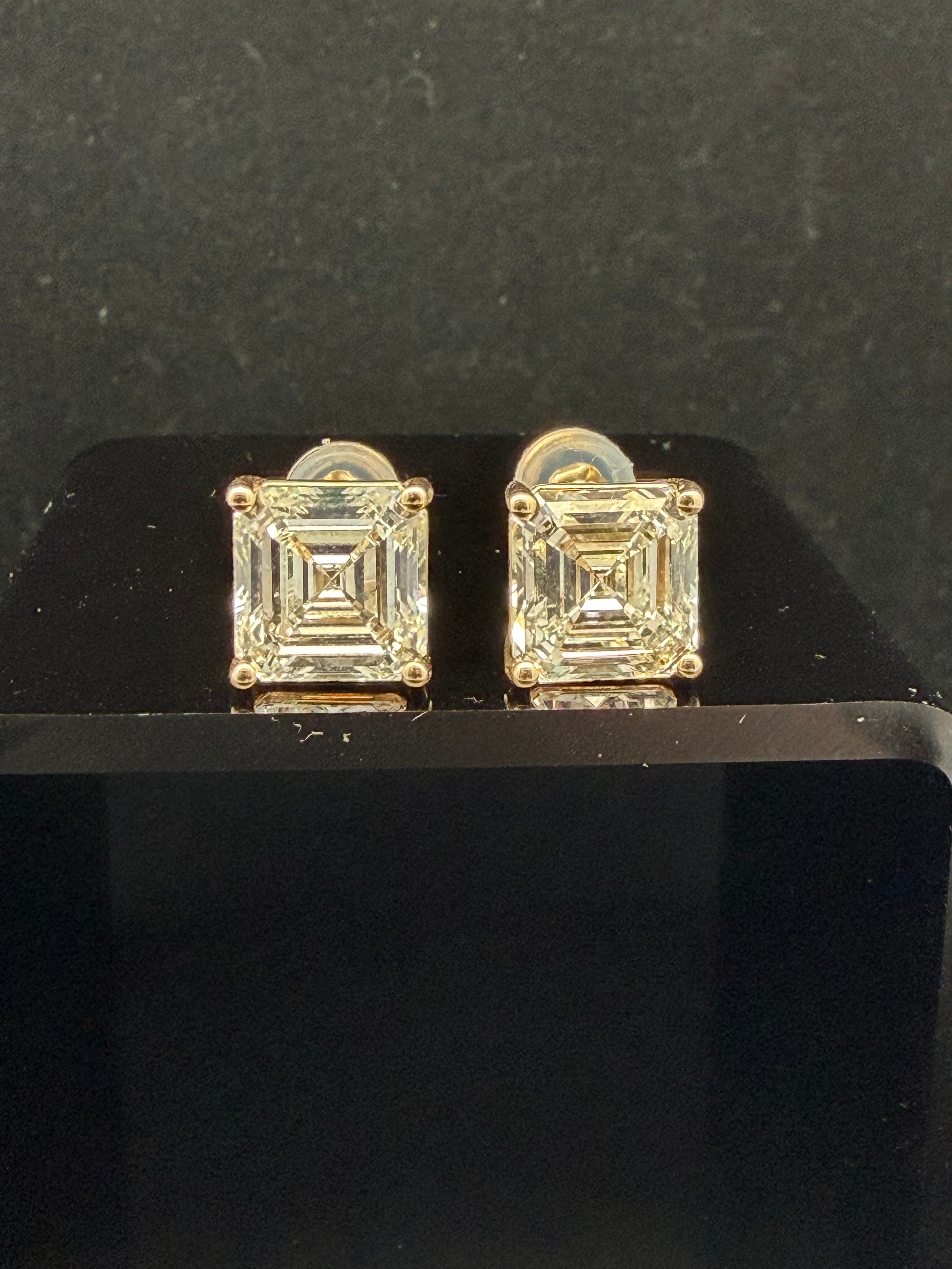 A Pair of 14K Gold Asscher-Cut Diamond Stud Earrings