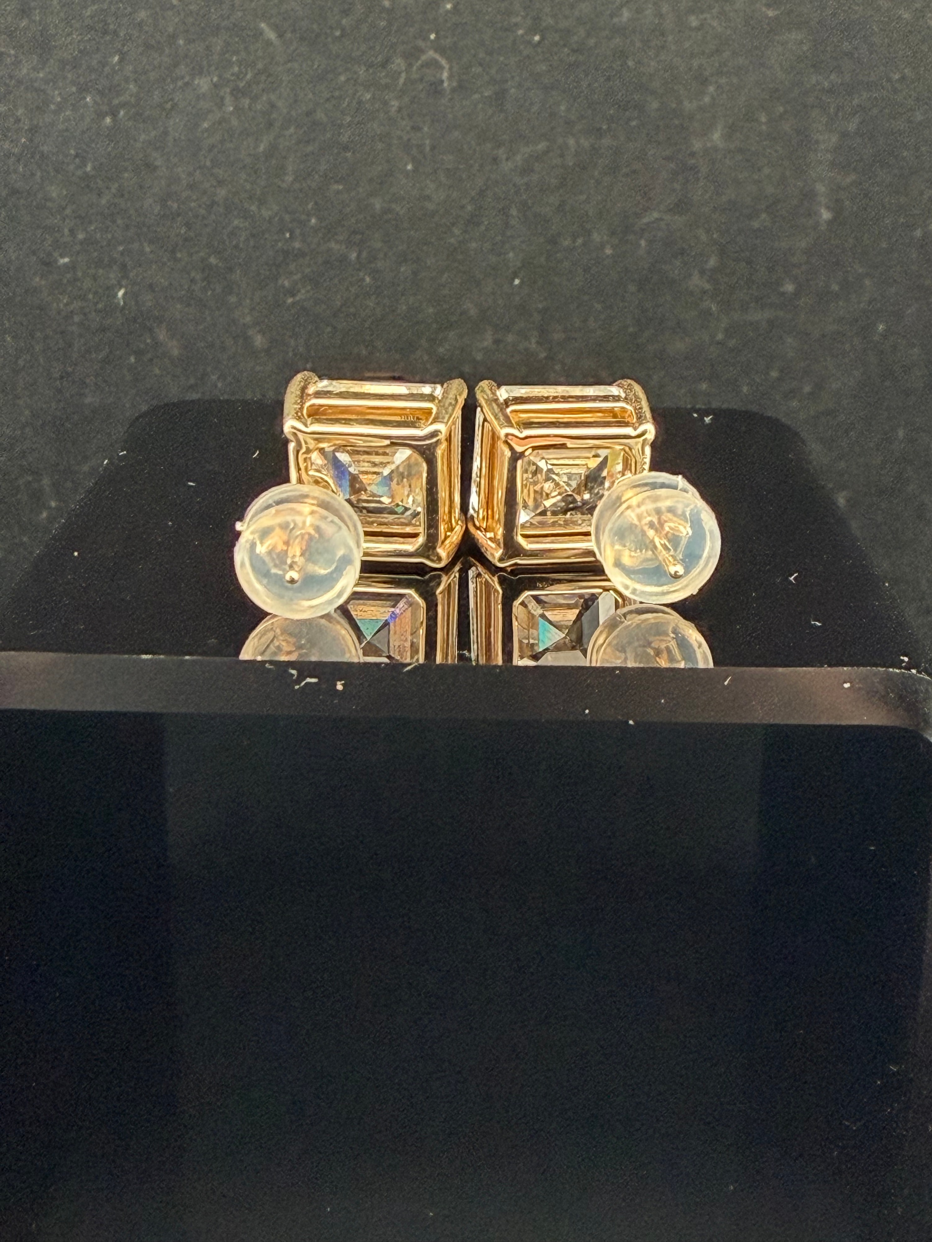A Pair of 14K Gold Asscher-Cut Diamond Stud Earrings
