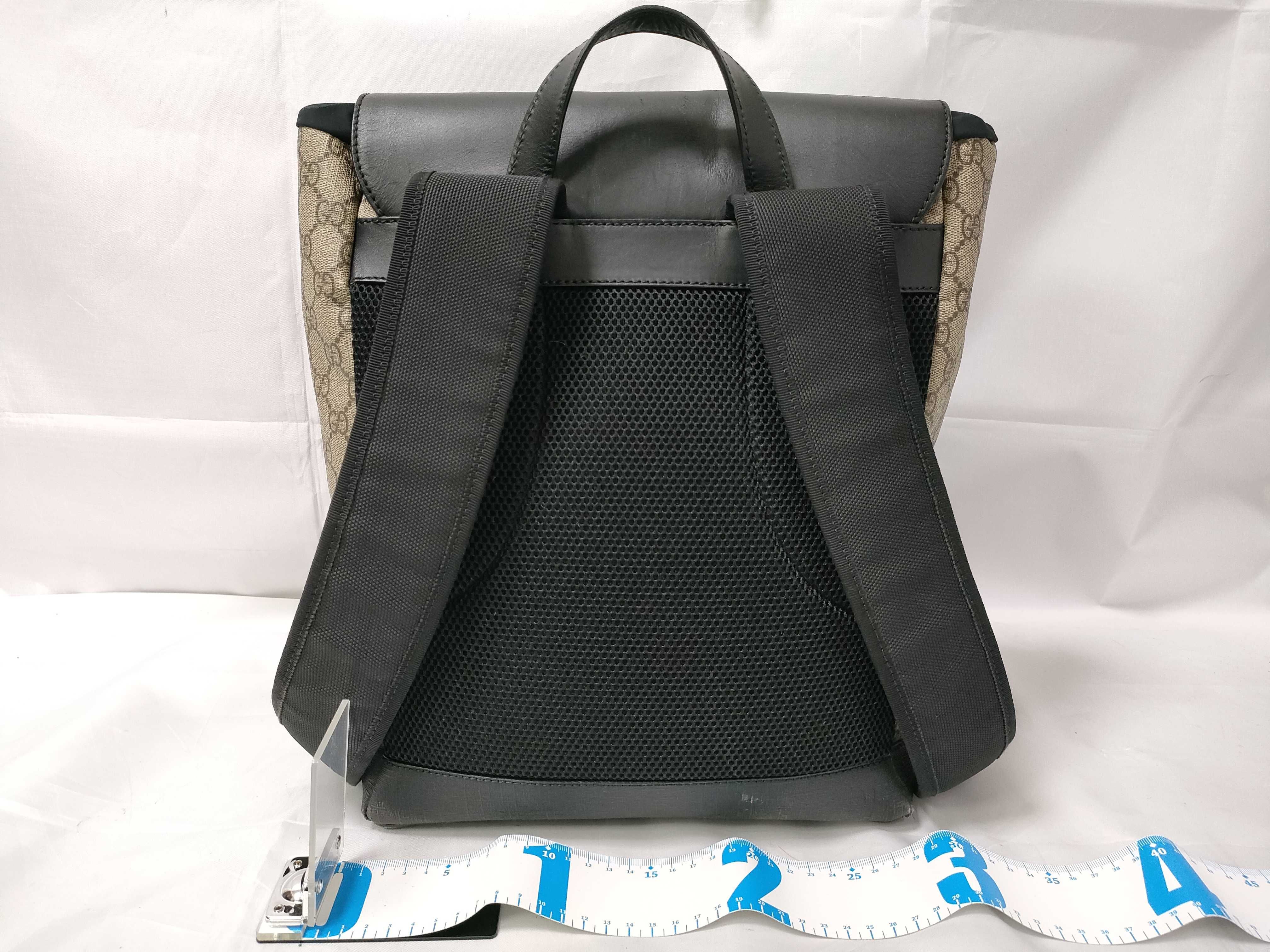 Gucci GG Supreme Monogram Buckle Backpack in Beige and Black