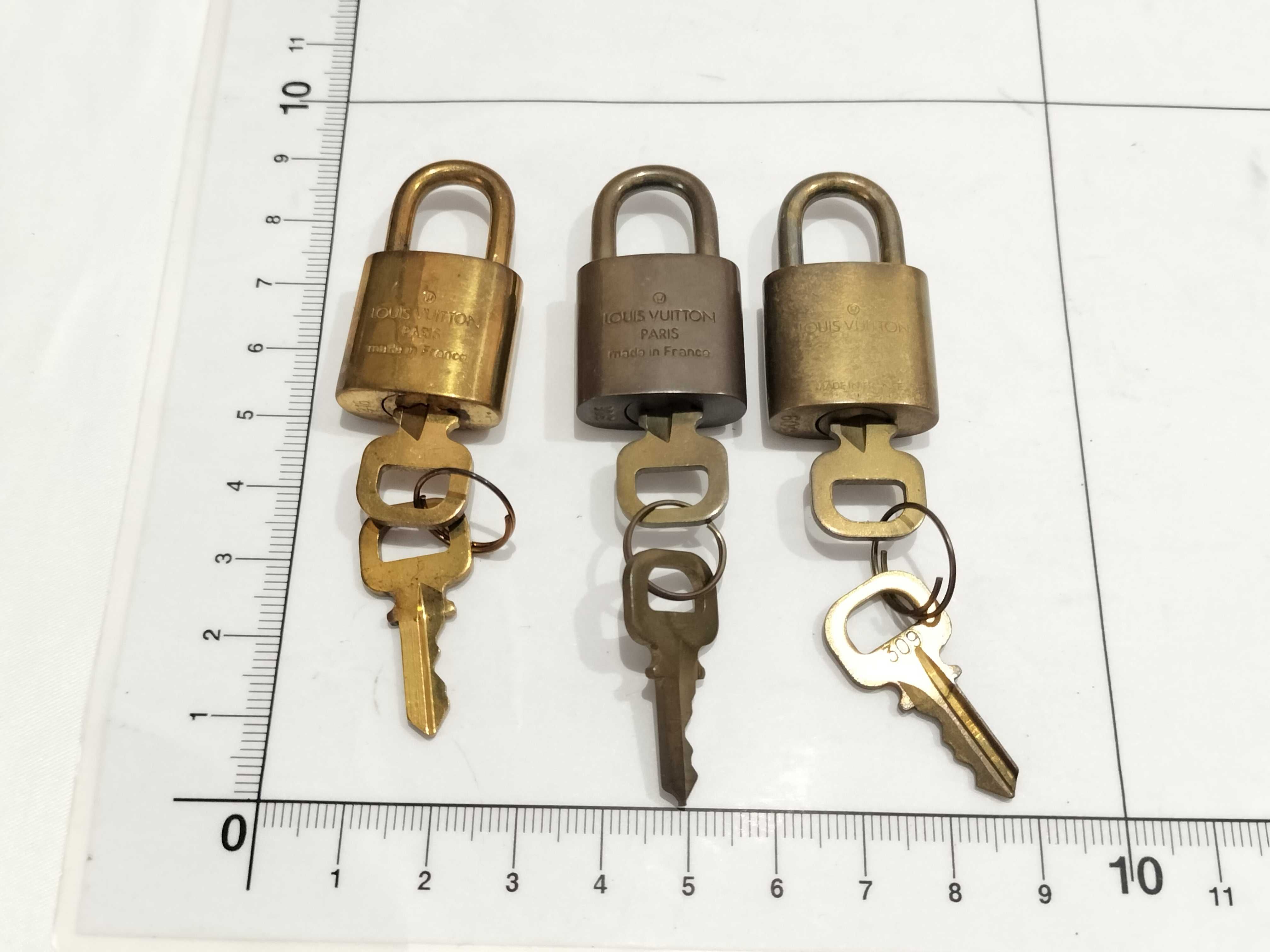 Three Vintage Louis Vuitton Brass Padlocks and Matching Keys