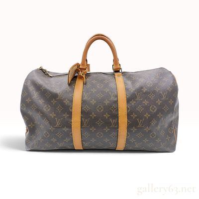 Vintage Louis Vuitton Monogram Keepall 55 Travel Bag. A vintage Louis Vuitton Keepall 55 travel 