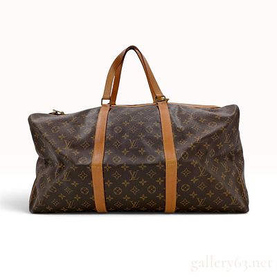 Vintage Louis Vuitton Monogram Canvas Keepall 55 Travel Bag. This Louis Vuitton Keepall 55 is a 