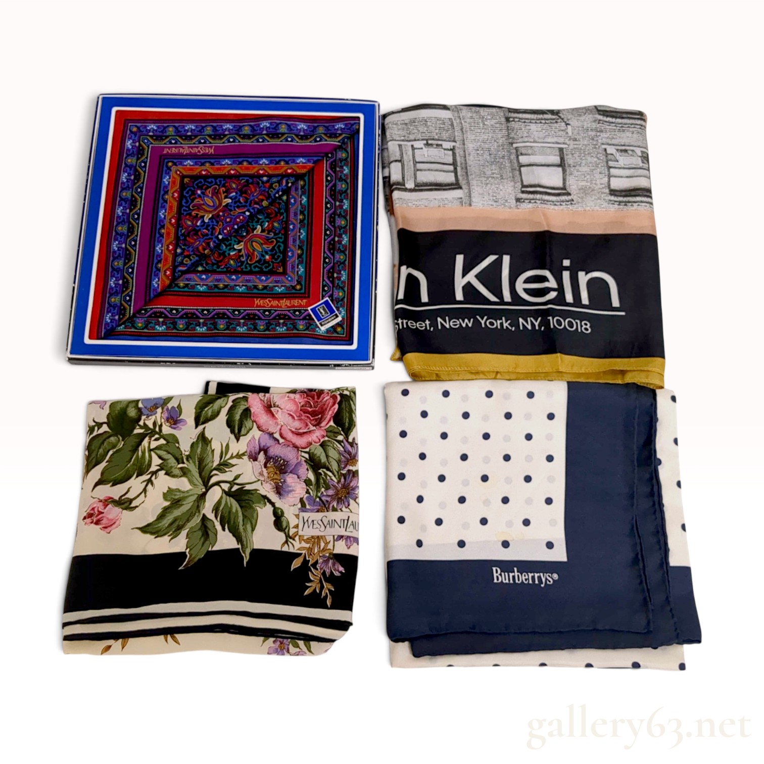 A Collection of Yves Saint Laurent, Burberrys, and Calvin Klein Designer Scarves