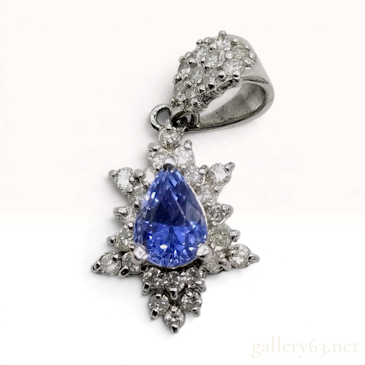 A Platinum Pear Cut Tanzanite and Diamond Snowflake Pendant