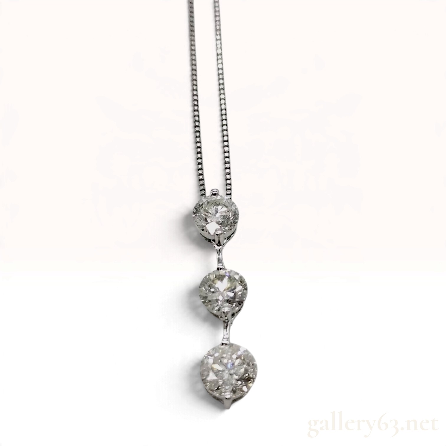 Platinum and 1.051ctw Three Stone Round Brilliant Cut Diamond Drop Pendant Necklace
