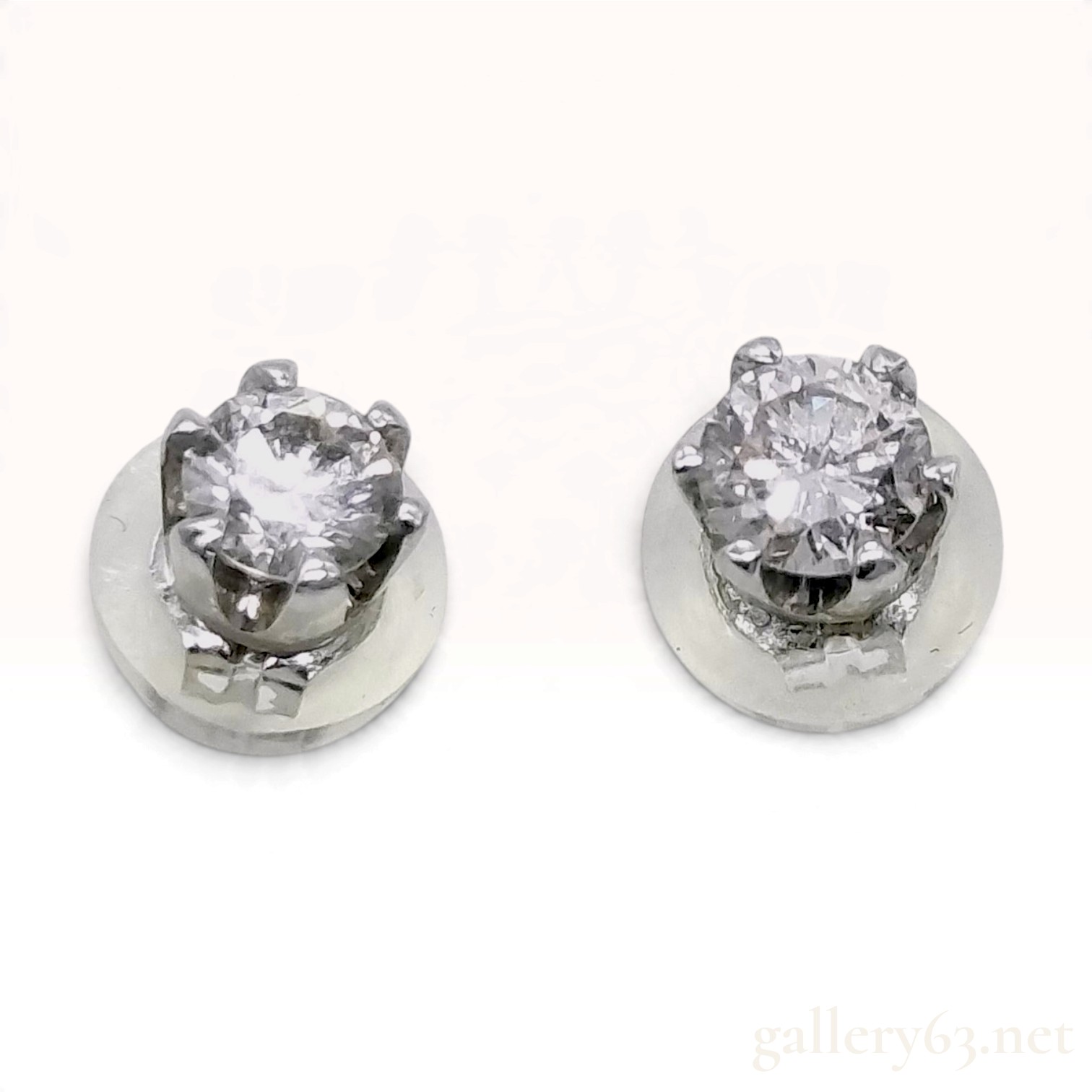 A Pair of Platinum and Round Brilliant Cut Diamond Stud Earrings