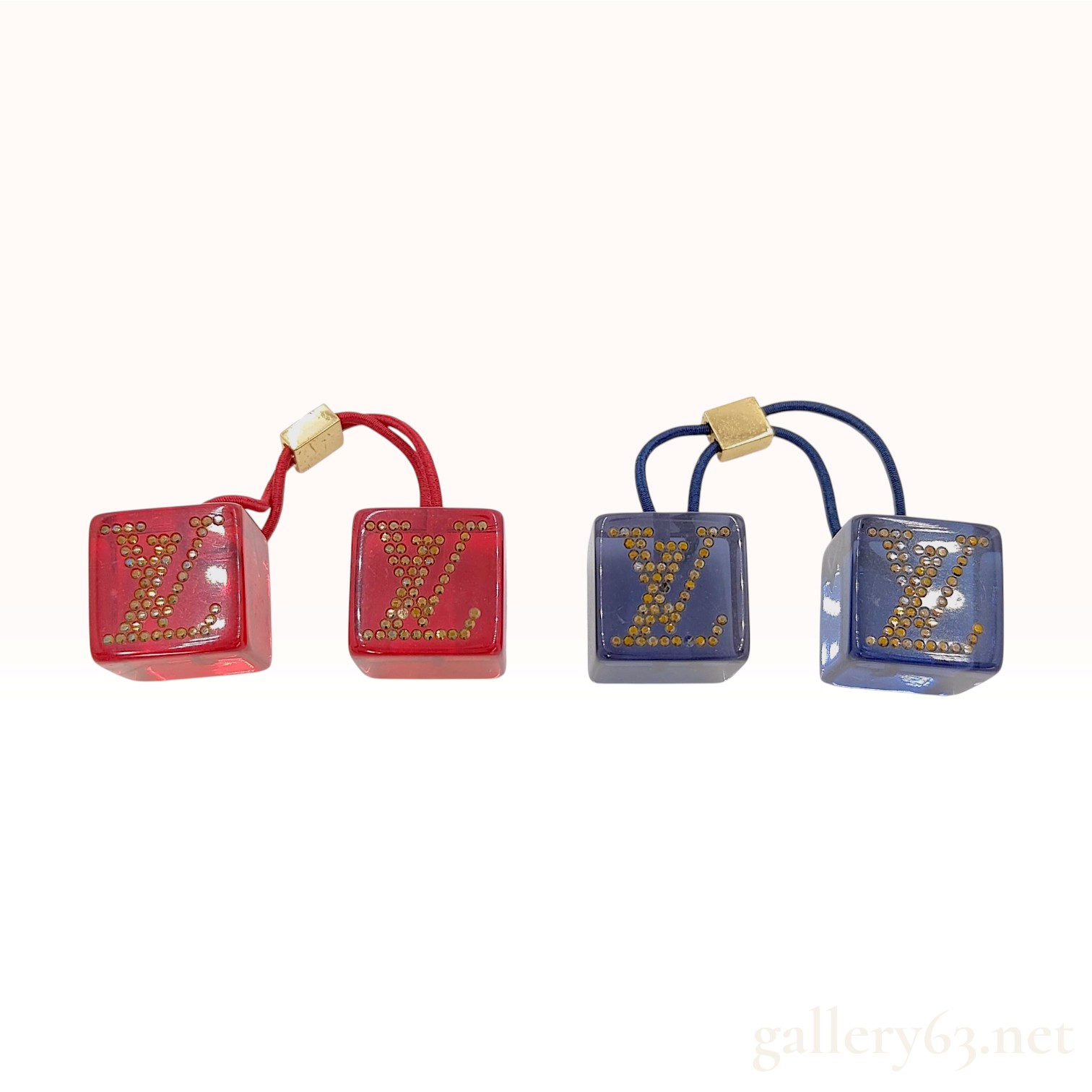 A Pair of Louis Vuitton Inclusion Monogram Navy Blue and Red Resin Cube Hair Ties