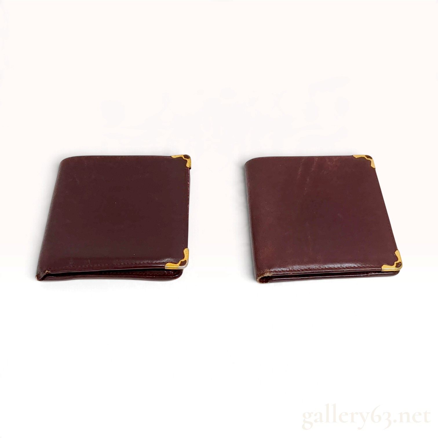 Two Vintage Must de Cartier Bordeaux Leather Wallets