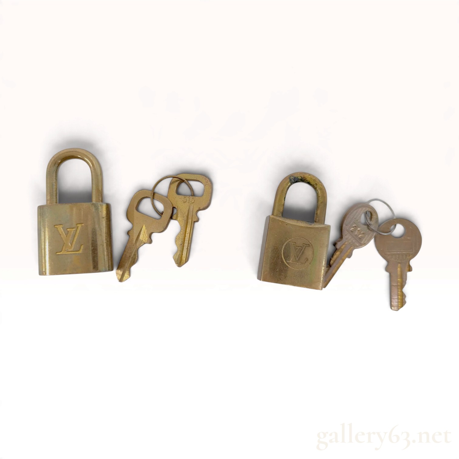 A Pair of Vintage Louis Vuitton Brass Padlocks and Keys