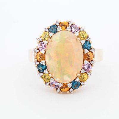 14KYG Opal & Multicolor Sapphire Dress Ring, 7.25. 14K Yellow gold ring
with 14 x 10mm crystal