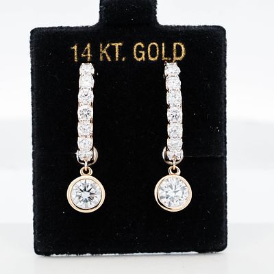 14KYG 3.25ctw Lab Grown Diamond Huggie Earrings 7.6 grams Each hoop features a 0.85ct bezel-set 