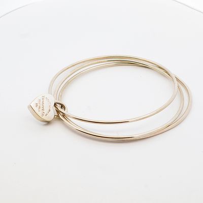 Tiffany and Company sterling silver triple band bracelet. Tiffany and Company sterling silver