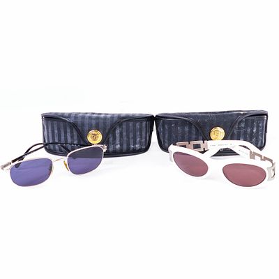 Fendi Sunglasses Lot: 2 Pairs. Fendi lot including one pair of white oval‑frame sunglasses with 