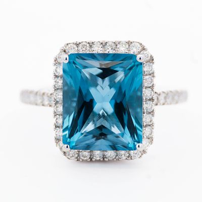 14K WG Blue Topaz & Diamond Ring, size 7. A high-impact cocktail ring featuring a richly 