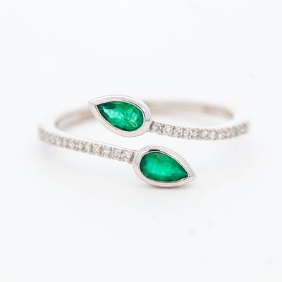 14K WG Emerald & Diamond Ring, size 7. 14K white gold bypass ring terminating with two pear cut 