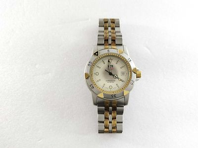 TAG Heuer 955.713G Two-Tone Men’s Watch 40mm. Authentic TAG Heuer men’s wristwatch featuring a 