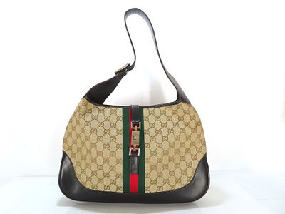 Gucci Jackie Handbag. Gucci Jackie Sherry Line bag in beige GG monogram canvas with brown 