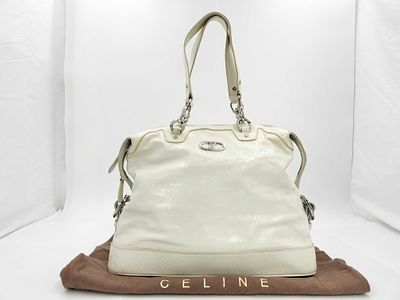Celine White Macadam Leather Handbag. Celine handbag having a soft rectangular body with rounded 