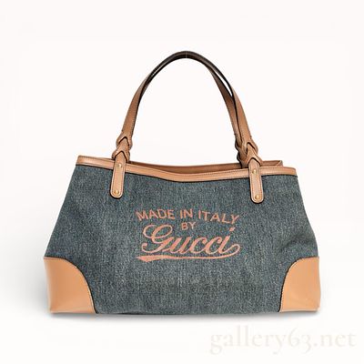 Gucci Craft Logo Denim and Leather Handbag. Gucci handbag crafted of blue denim fabric featuring 