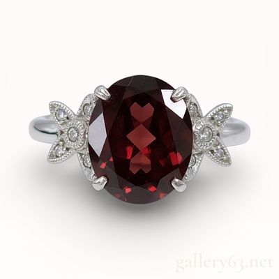 3.10 Carat Garnet and Diamond Platinum Ring sz 6. Authentic important 3.10 carat oval cut red 