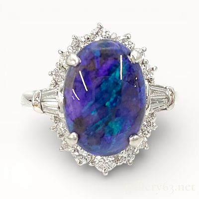 Platinum 2.54ct Opal Cabochon & .49ctw Diamond Cocktail Ring. Platinum ring set with a 2.54ct 