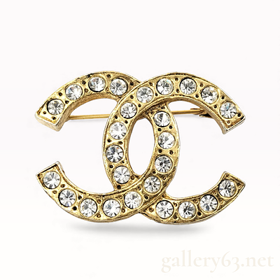Chanel 1970s 24K Gold Plated Rhinestone CC Logo Brooch. Chanel brooch having an interlocking CC 