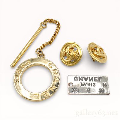 Collection of Chanel Gold-Tone Pendant Top, Earrings, and Scarf Ring Set. Authentic Chanel 