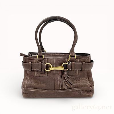 Coach Leather Shoulder Bag. Coach shoulder bag having a structured silhouette rendered in brown 