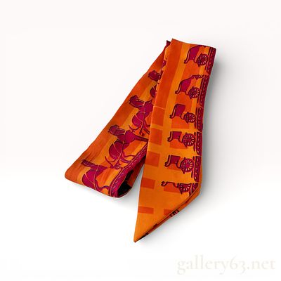 Herm&egrave;s Twilly Orange Silk Scarf with Equestrian Motif. Authentic Herm&egrave;s Twilly silk scarf having 