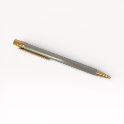 Cartier Santos de Cartier ballpoint pen in brushed steel with gold-plated accents. Authentic 