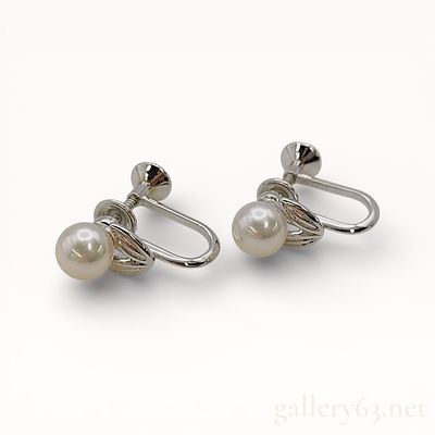 Mikimoto Pearl Earrings With Box. Authentic pair of earrings with matching silver metal mounts 