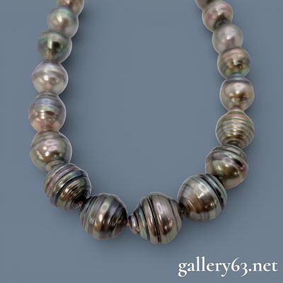 Black Butterfly Pearl Necklace. Authentic pearl necklace made from a single strand of dark 