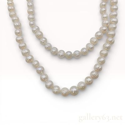 Opera Length Individually Knotted 8.0-10.0mm Semi-Round Cultured Pearl Strand Necklace. Long 