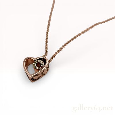 Coach Rose Gold-Tone Rhinestone Heart Pendant Necklace. Coach necklace featuring a rose 